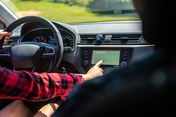 Woman driving car using gps navigation system
