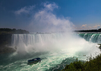 A wide, panoramic view capturing the impressive American Falls and the adjacent Bridal Veil Falls...