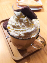 Specialty coffee with cream and chocolate