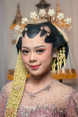 Elegant Asian bride in detailed Javanese kebaya, smiling gracefully with perfect makeup, ornate...