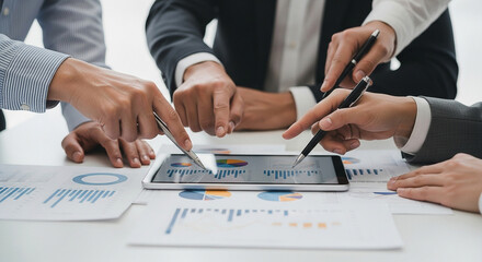 Collaborative Business Team Analyzing Data, Featuring Charts and Graphs on a Tablet, Showcasing Financial Growth and Strategic Planning