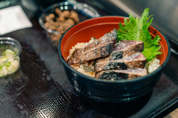 KOCHI, JAPAN - may 2 2025 Seared bonito tataki served on a plate