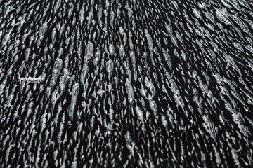 Patterns on abstract glass. Damage to glass. Broken or damaged background on a glass wall.
