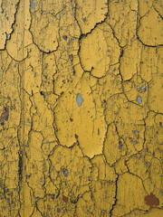 Weathered Yellow Paint Texture: Scratched and Dinged Surface Background