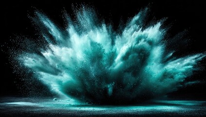 Teal powder explosion on black background