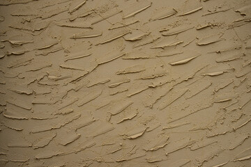 Textured stucco wall with gritty surface.