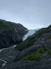 Famous Blue Glacier Descending into Rugged Valley at Glacier Bay National Park, Alaska – Majestic Natural Wonder and Pristine Wilderness Landscape