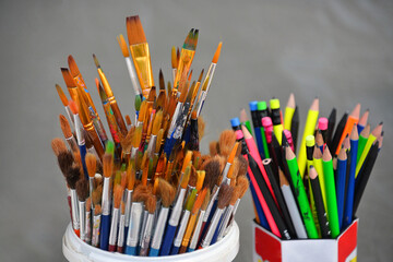 box of art brushes and another box of colored pencils drawing art hobby passion