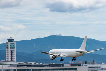 Plane Landing At Fukuoka Airport On Clear Summer Afternoon