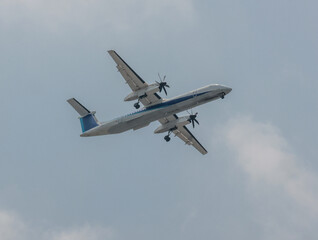 Passenger Jet Making Landing Approach On Summer Day