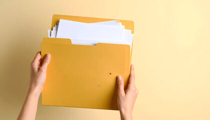 Hand Holding File Folders