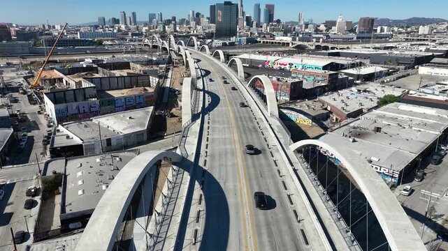 Overhead Drone View Across 6th Street Bridge, Downtown Los Angeles on March 6, 2025 - Showcasing High-Rises and Cultural Graffiti in the Vicinity of Arts District, Southern California DTLA