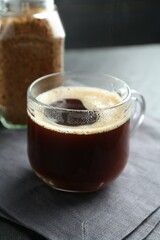 Aromatic instant coffee on black table, closeup