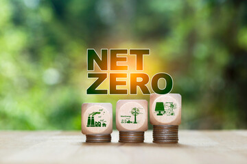NET ZERO" text with wooden blocks, CO2 reduction, wind energy, and solar power, symbolizing sustainable development and environmental responsibility.