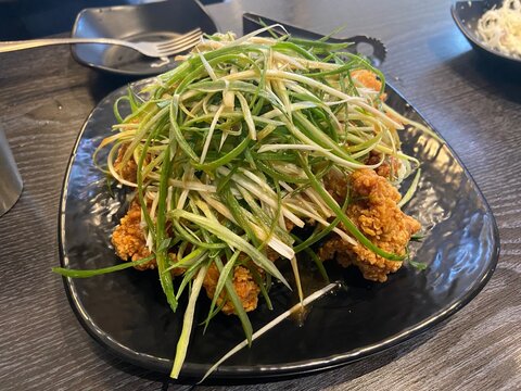 Korean Fried Chicken with Green Onion Salad and Soy Sauce Pa-dak