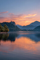 Fototapeta premium serene sunset over lake bled in slovenia showcasing vibrant colors reflecting in tranquil waters