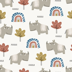 Cute cartoon rhinos seamless pattern with rainbow and tree. Vector illustration for kids or baby apparel, textile, nursery, bedding, wrapping paper, kindergarten, print, cover and more