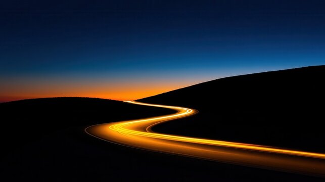 Serene winding road illuminated by car lights against a twilight sky and distant hills - Powered by Adobe