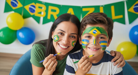 Mother and son with Brazil flag face paint celebrating