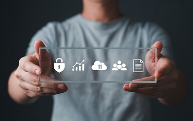 A person's hand interacts with a holographic interface representing a multi-layered data management system, showcasing cloud computing, security, and user analytics for business.