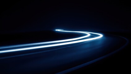 A night road curves into darkness