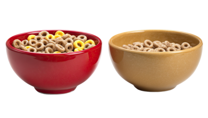 Two bowls of cereal.  One red, one tan.  Both filled with ring-shaped cereal.  One bowl has yellow rings