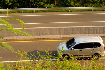 Modern Car on a Curved Road: Dynamic Motion and Nature