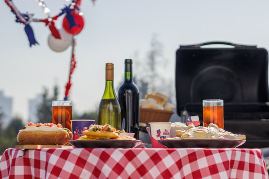 Chilean Independence Day: Traditional food table with completos, empanadas, sopaipillas, wine and chicha during Independence Day