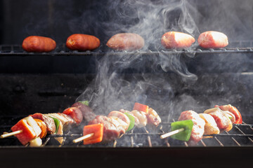 Chilean Independence Day: anticuchos and longanizas cooking on smoky grill