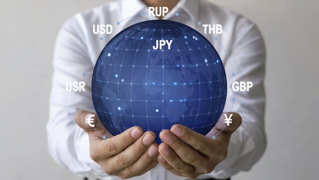Global currency exchange concept with world globe in hands for international finance and investment