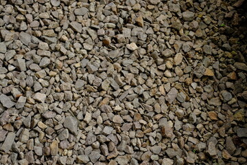 Textured Background with Small Stones, Rough Stone Aggregate Detail, Pathway Material: Small Rocks, Natural Gray Stone Pile, Garden Gravel Texture, Construction Aggregate Close-up
