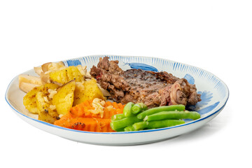 The High resolution photo of steak with potatoes, green beans and mushrooms using the focus stack technique.
