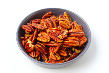Delicious salted pecan nuts scattered.