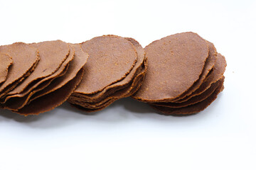 Fermented soybean discs, known as “Thua Nao,” a traditional Thai seasoning used to enhance flavor in Northern cuisine.