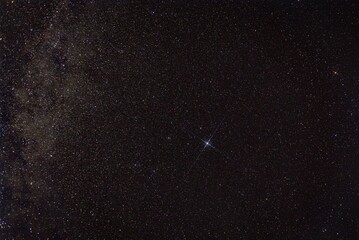 Vega star in the night sky against the background of the Milky Way