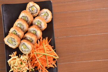 Delicious Japanese cuisine platter with sushi rolls, fried tofu and rice bowl for healthy eating