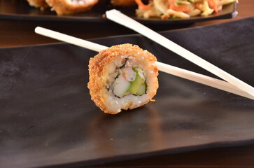 Delicious Japanese cuisine platter with sushi rolls, fried tofu and rice bowl for healthy eating