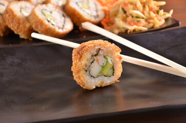Delicious Japanese cuisine platter with sushi rolls, fried tofu and rice bowl for healthy eating