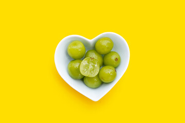 Shine muscat grape on yellow background.