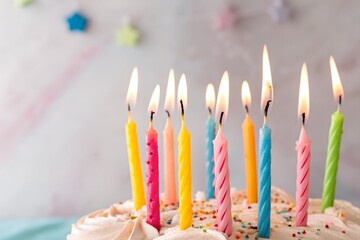 Lighted birthday candle wax photographed up close against a blue background. design illustration