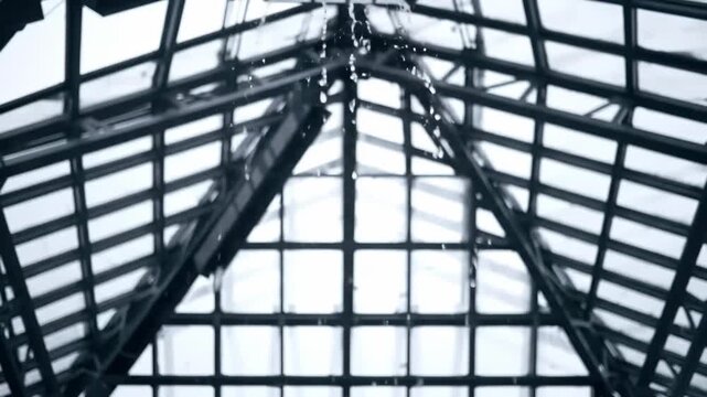 Architectural marvel: Modern building's geometric glass roof with metallic structure