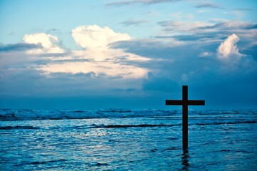 Wooden Cross On Beach Morning Storm Cloud Sky