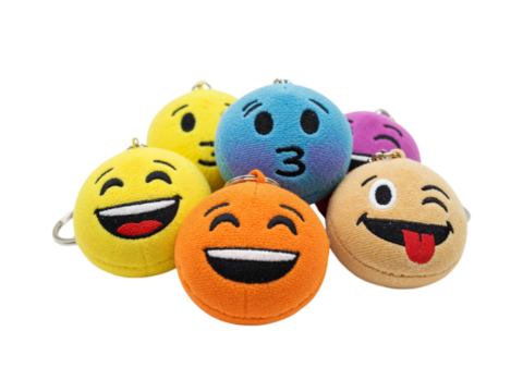 Collection of colorful plush emoji toys with different expressions isolated on transparent background