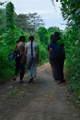 The four girls continue their walk in a relaxed pace, taking in the peaceful morning atmosphere as...