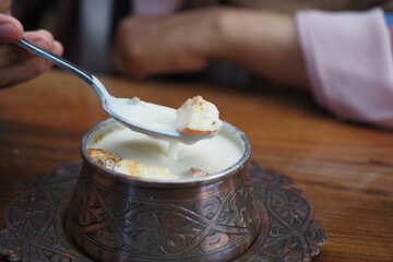 creamy soup served in traditional bowl with spoon