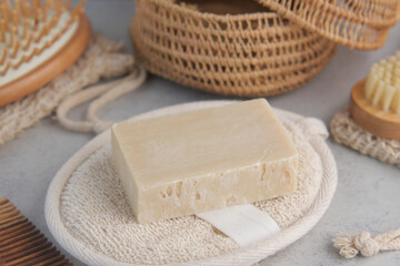 Natural soap on a woven tray with eco accessories