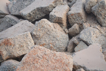Pile of broken concrete stones at a construction site