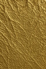 Gold crumpled paper texture background close up