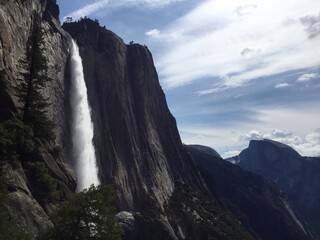 yosemite national park california - waterfall with half dome in the background 