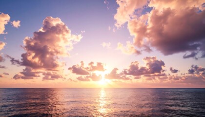 Vast ocean sunset, soft clouds